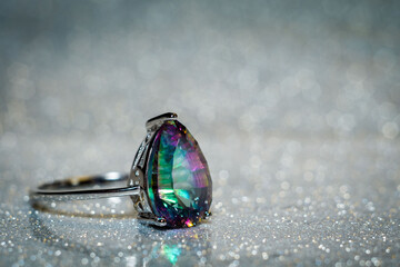 Modern silver ring with mystic topaz