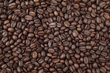 Close-up background of roasted coffee beans.