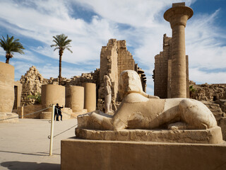 a sphinx with the face of a pharao in karnak temple