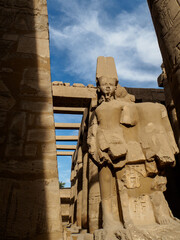 The godlike face of a pharaonic statue in karnak temple complex