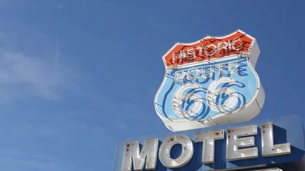 Rolgordijnen Motel retro sign on historic route 66 famous travel destination, vintage symbol of road trip in USA. Iconic lodging signboard in Arizona desert. Old-fashioned neon signage. Classic tourist landmark © Dogora Sun