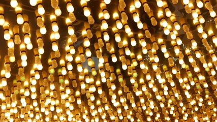 Old fasioned electric lamps blinking and glowing at night. Abstract close up of retro casino...