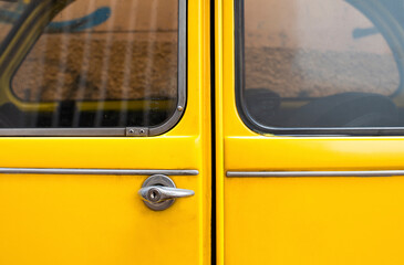 Close-up detail of a Black Yellow vintage citroen 2cv car