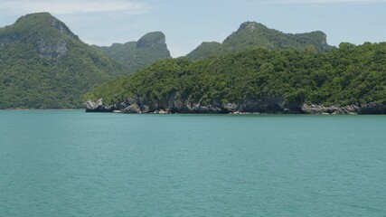 Group of Islands in ocean at Ang Thong National Marine Park near touristic Samui paradise tropical resort. Archipelago in the Gulf of Thailand. Idyllic turquoise sea natural background with copy space