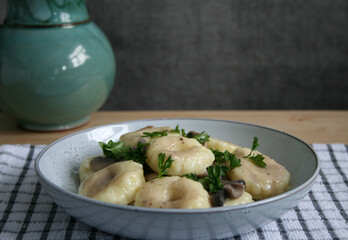 Potatoes dumplings with mushroom sauce
