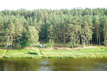 Fototapeta na wymiar People in the camper near the Nemunas river in Birstonas 