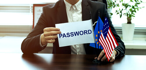 man take a flag with text PASSWORD with flags on the office background
