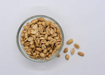 Brown peanuts on white background