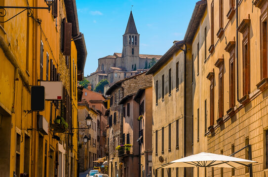 A view up the main street of the medieval city of Todi, Umbria, Italy towards the cathedral in summer