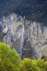 Fototapeta na wymiar View of Landscape waterfall from forest on mountain in nature and environment at swiss