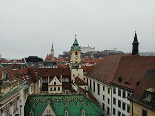Obraz premium Slovakia, Bratislava. Historical old city centre. Aerial view from above, created by drone. Foggy day town landscape, travel photography.