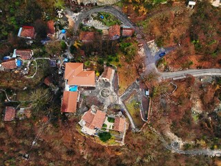 Beautiful aerial drone photography. Country Georgia from above. Mountain Monastery and Church of Katskhi, Chiatura region. Sunset aerial view