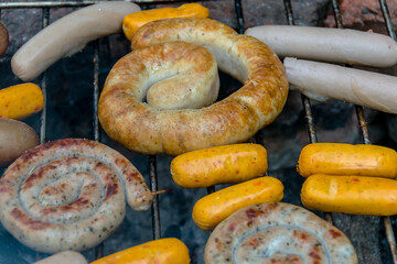 assorted meat sausages on the barbecue gril