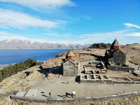 Sevan Lake and Sevanavank oldest church. Mountains country Armenia. Aerial view from above by drone.