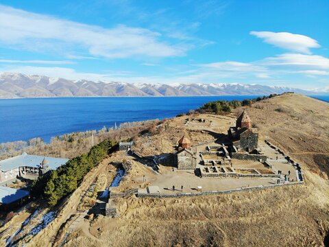 Sevan Lake and Sevanavank oldest church. Mountains country Armenia. Aerial view from above by drone.
