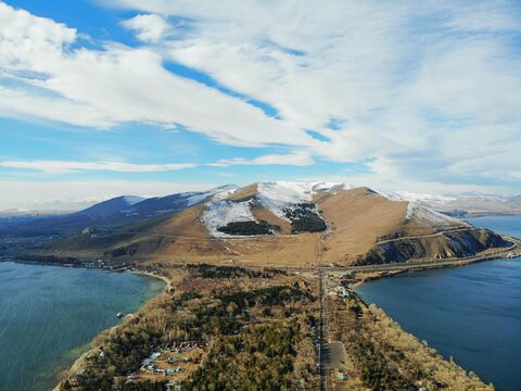 Sevan Lake and Sevanavank oldest church. Mountains country Armenia. Aerial view from above by drone.