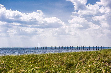 Beautiful sea shore seascape and destroyed wooden bridge St mark state park,Florida.