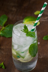 Mojito coctail with lime and mint leaves.