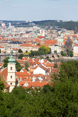 Fototapeta na wymiar Prague City with Charles Bridge and green Nature from the Hill Petrin, Czech Republic