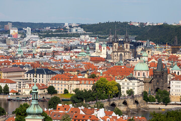 Fototapeta na wymiar Prague City with Charles Bridge and green Nature from the Hill Petrin, Czech Republic