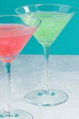 Several glasses of various delicious fruit non-alcoholic cocktails on a bright background. Health drinks