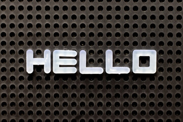 White color alphabet with word hello on black pegboard background © bankrx