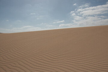 The Sand Dunes of Corralejo. Desert area near dune beach in Fuerteventura. 