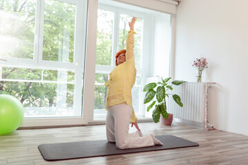Fototapeta na wymiar Elderly woman doing yoga
