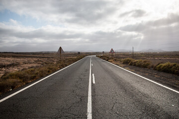 
lonely road through the desert