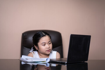 
Girls are learning through the internet at home.