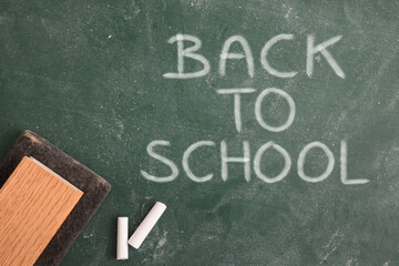 Fototapeta na wymiar Blackboard with white chalk and eraser back to school top