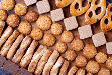 Cookie and waffle assortment in rows. Top view. Pastry background