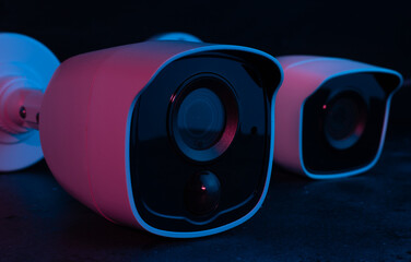 camera Security on dark background in pink and blue light