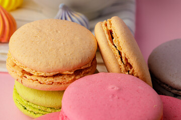 Stack of colored macaroon cookies close up