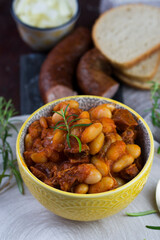 Stewed beans in tomato sauce with herbs and spices.  Top view.