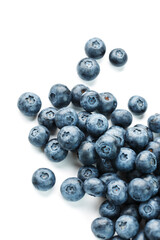 Blueberries isolated on a white background. A scattering of ripe, juicy, delicious and healthy berries.