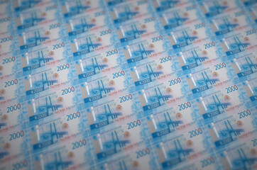 2000 russian rubles bills printed in illegal money production conveyor. Collage of many fake bills....