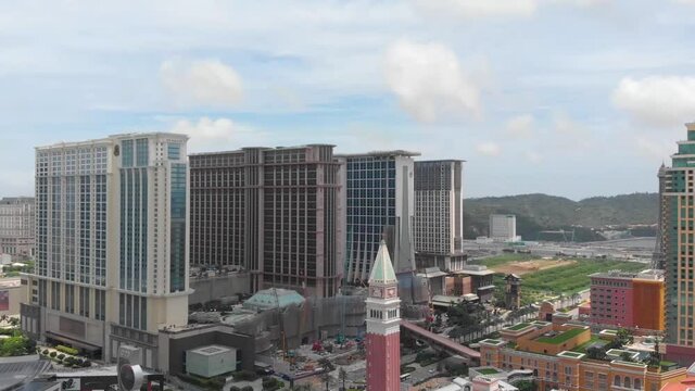 Aerial pan reveal of Cotai Strip in Macau on sunny day