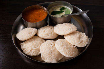 lower angle view of south karnataka homemade rave idly, sambar & chutney