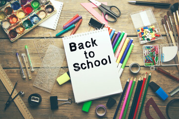 back to school text on notepad