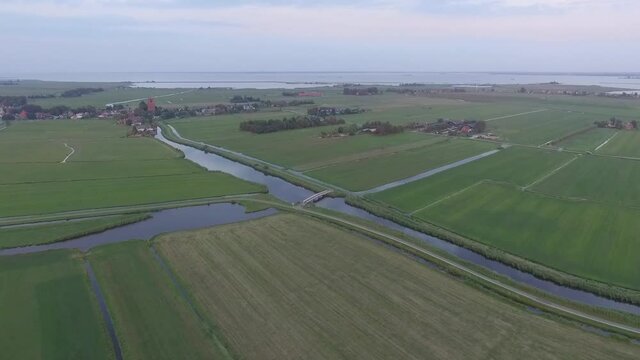 Droneshots of sheeps in the fields of Holland