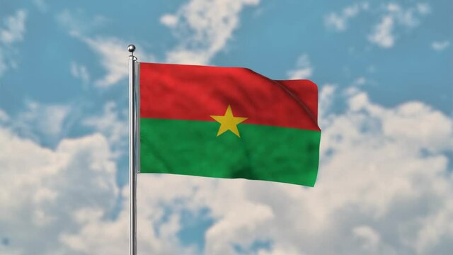 Burkina Faso flag waving in the blue sky realistic 4k Video.