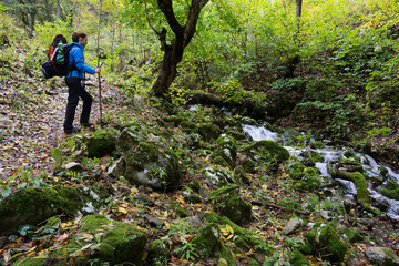 Naklejka premium Young brunette girl trekking in Mehedinti Mountains, Romania, Europe