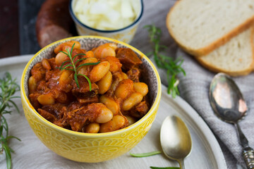 Stewed beans in tomato sauce with herbs and spices.  Top view.
