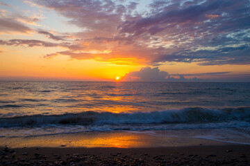 Fototapeta na wymiar The sun by the sea. sunrise or sunset