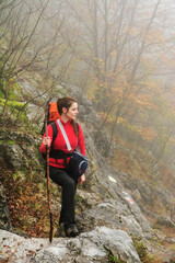 Naklejka na ściany i meble Young brunette girl trekking in Mehedinti Mountains, Romania, Europe