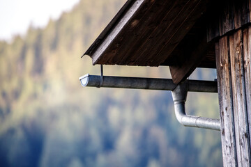 rainwater gutter oa a old house in the alps