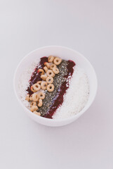 Appetizing breakfast smoothie bowl in a white plate. Healthy dessert recipe. 