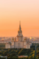 Moscow State University from a height. Panorama of the city at sunrise. Moscow landmark in the soft light of a golden dawn. A park. Stalin's skyscraper