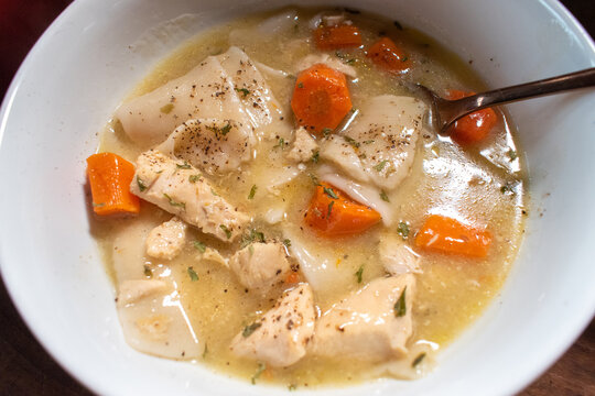 Top View Bowl Of Homemade Chicken And Dumplings With Carrots